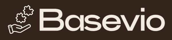 The logo for Basevio, featuring the brand name in a bold, bright pink font with a small hand holding two small pink gear-like icons on the left, set against a solid dark brown background.
